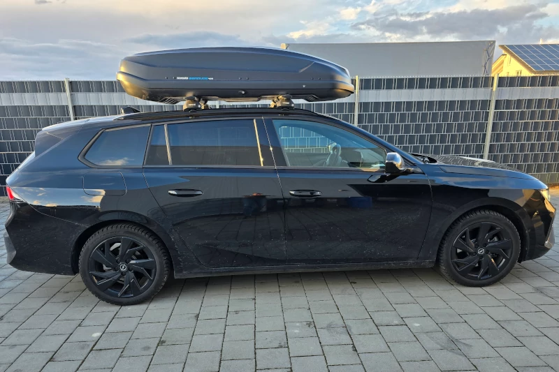 Eggenstein - eine 430-Liter Dachbox auf einem Opel Astra Kombi